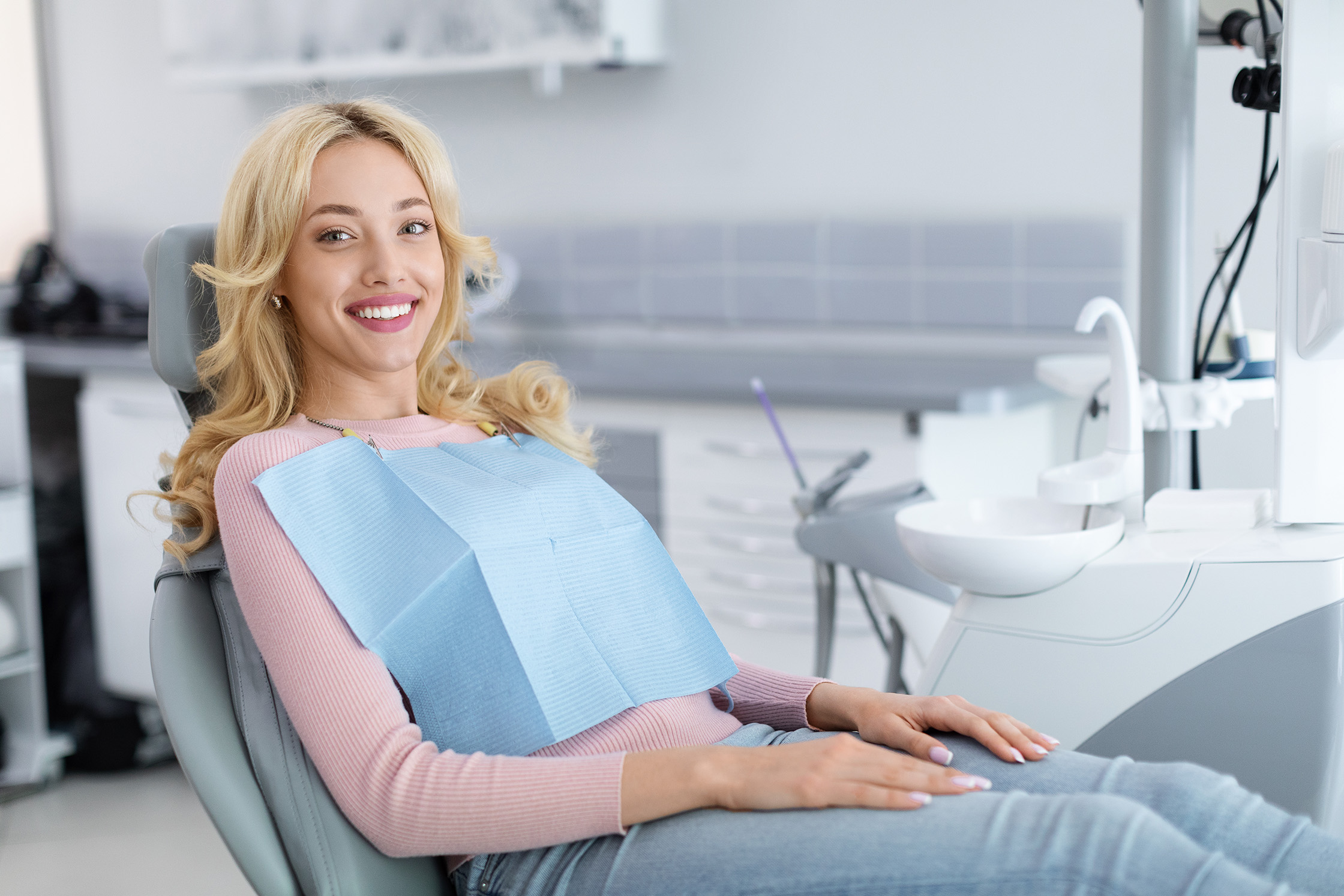 woman at dental appointment - University Dental Arts